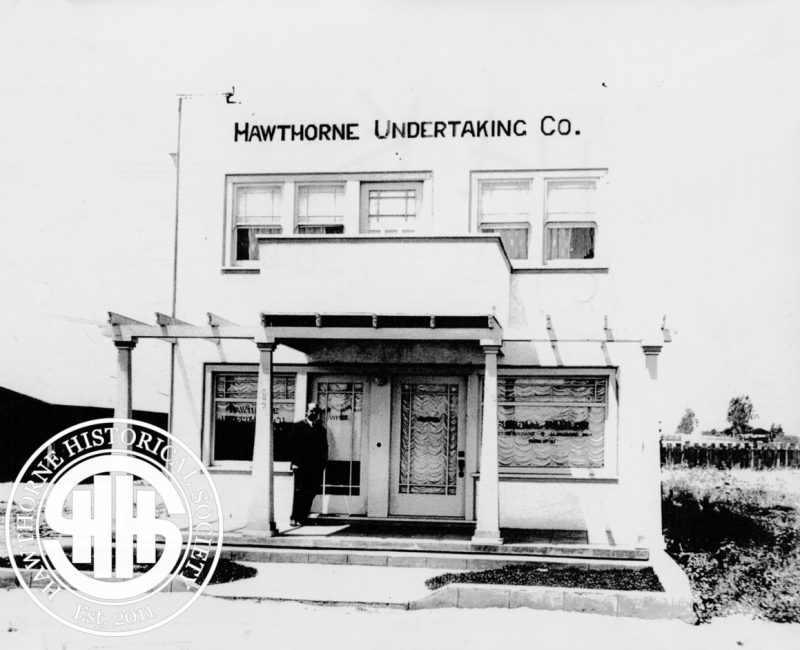 Historic image of the Mawthorne Undertaking Company storefront in Hawthorne, showcasing early 20th-century architecture and signage.