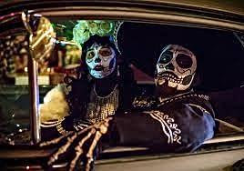 Day of the Dead themed display with decorated skulls and vibrant decorations at Hawthorne Historical Society.