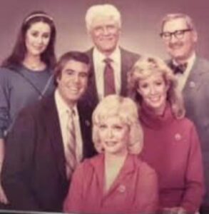 Group photo of six people, including men and women, dressed in formal attire, smiling for the camera, representing the Hawthorne Historical Society.