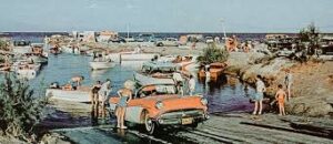 Vintage cars and people at Hawthorne harbor, celebrating local history in June 2023.