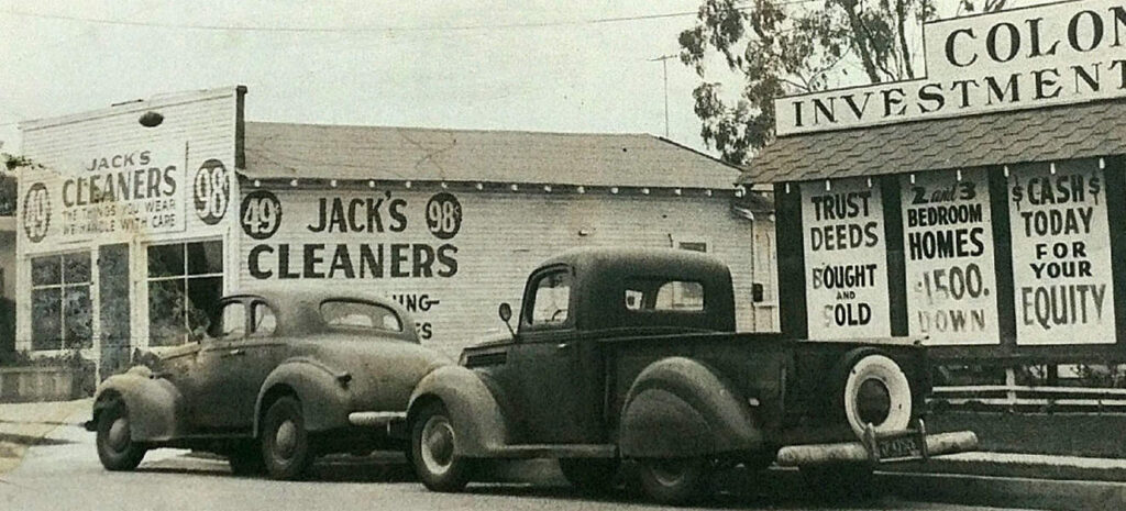 Vintage farm scene with classic cars and old-fashioned storefronts in Hawthorne.
