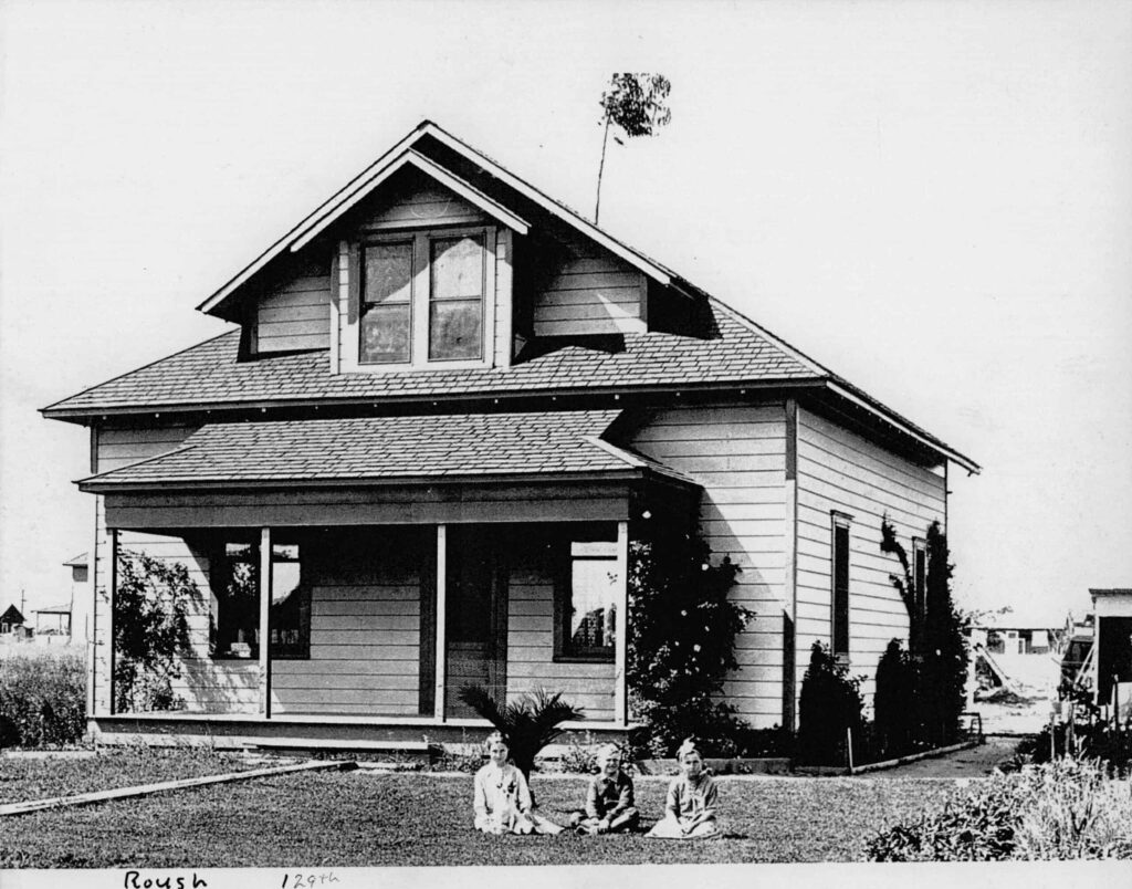 Historic Hawthorne house with children playing outside.