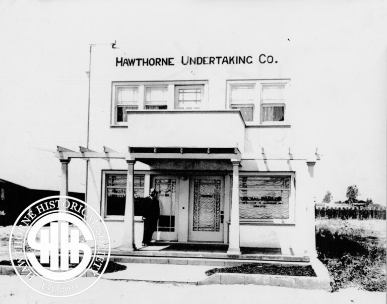Historic image of the Mawthorne Undertaking Company storefront in Hawthorne, showcasing early 20th-century architecture and signage.