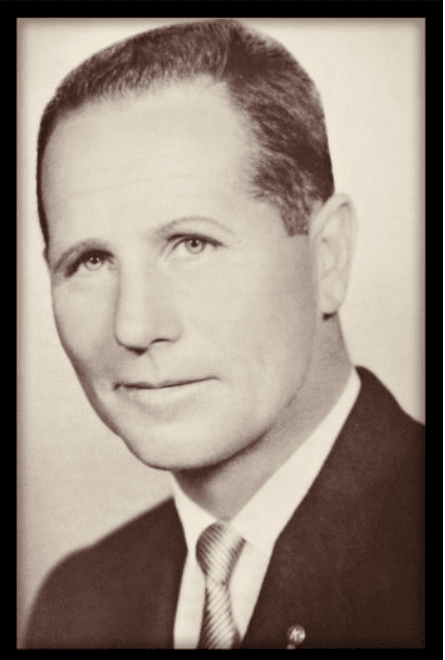 Vintage portrait of a man in formal attire, representing local history.