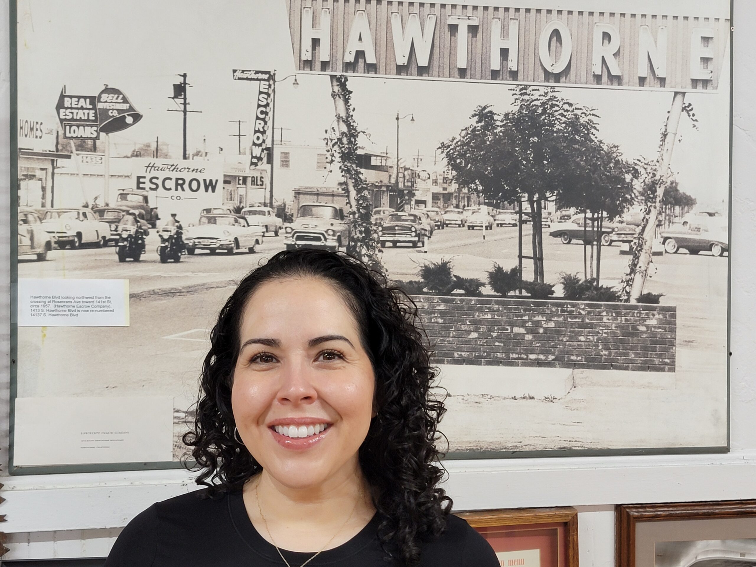Historic Hawthorne sign in black and white, showcasing the town's heritage and community spirit.