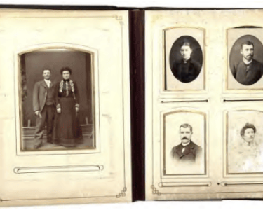An old family photo album with vintage photographs displayed on a page, showcasing historical images from Hawthorne's past.