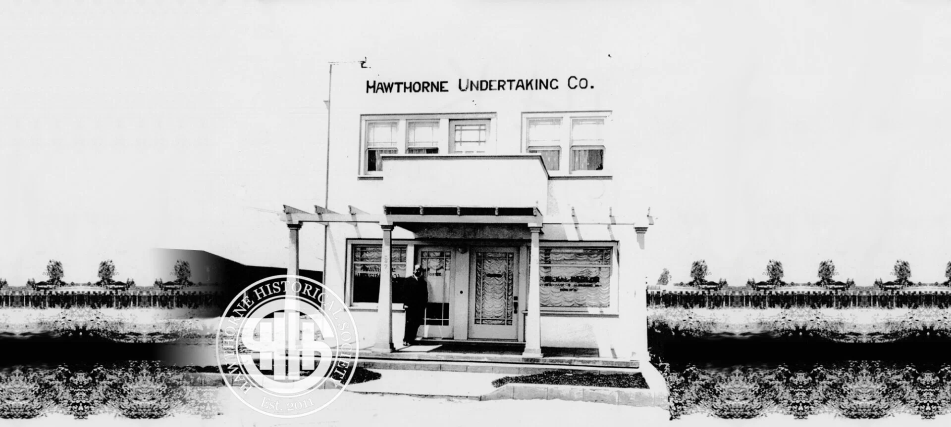 Historic black and white photo of the Hawthorne Undertaking Company building, showcasing early 20th-century architecture in Hawthorne, California.